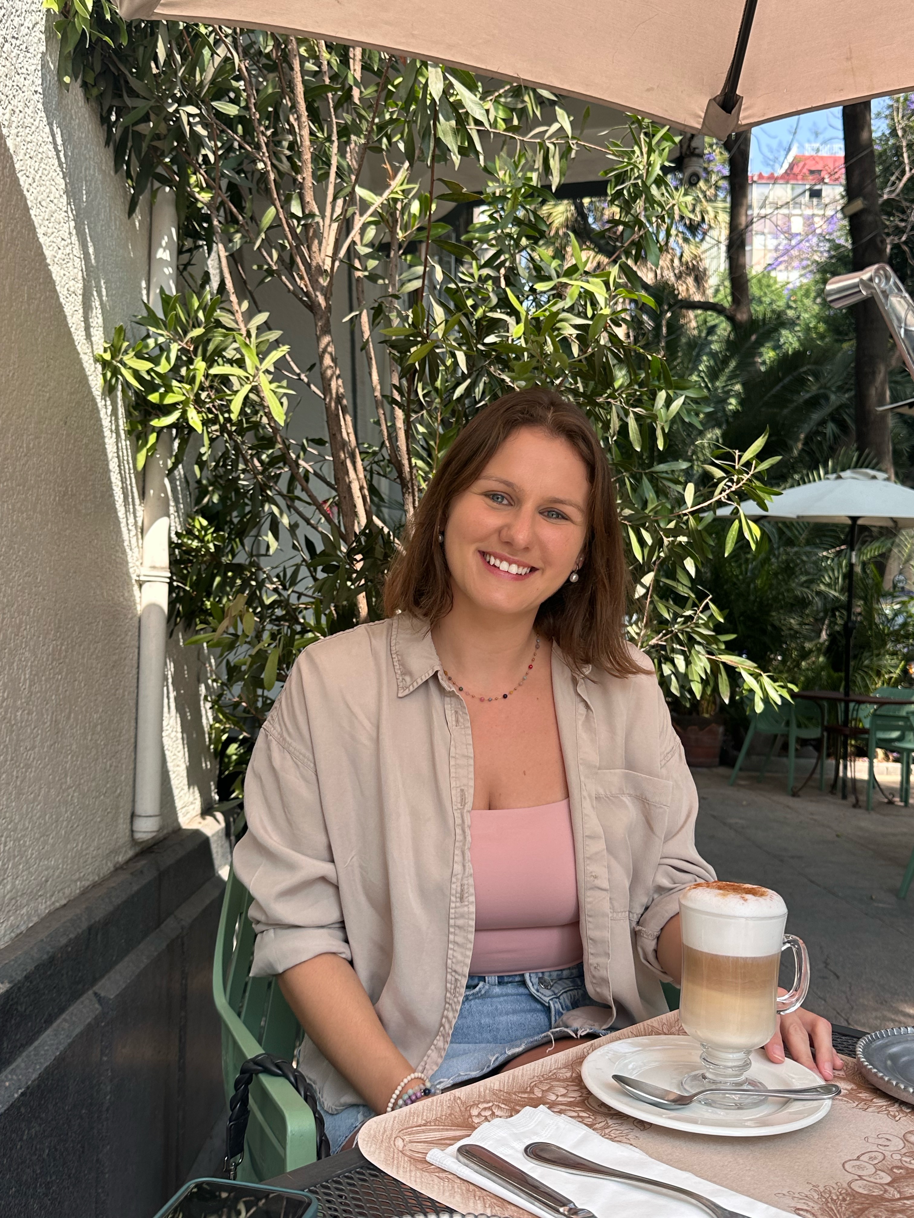 Jess sitting at a café